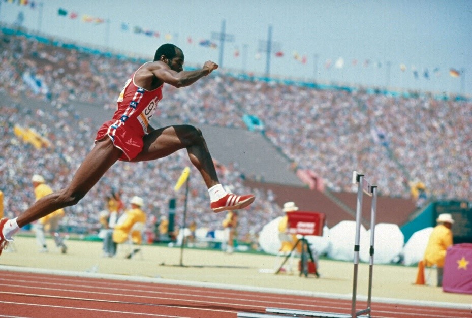 Track athlete jumping a hurdle