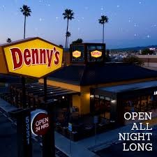 Denny's restaurant sign at dusk