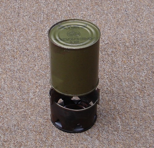 Heating a can of food on a c-ration stove
