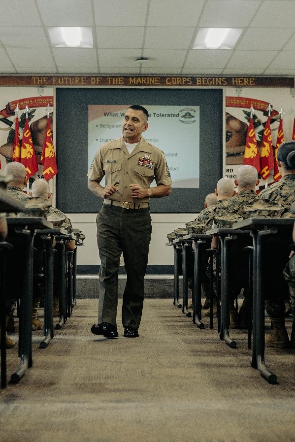 Marine sergeant walking through classroom at a lecture