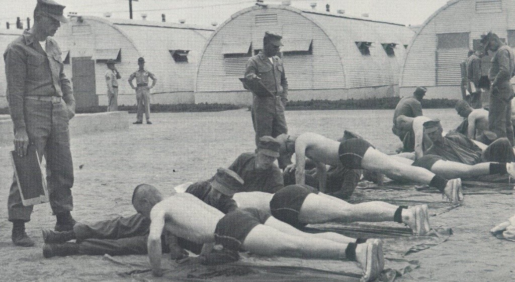 Historical photo of Marines doing pushups, circa 1960s