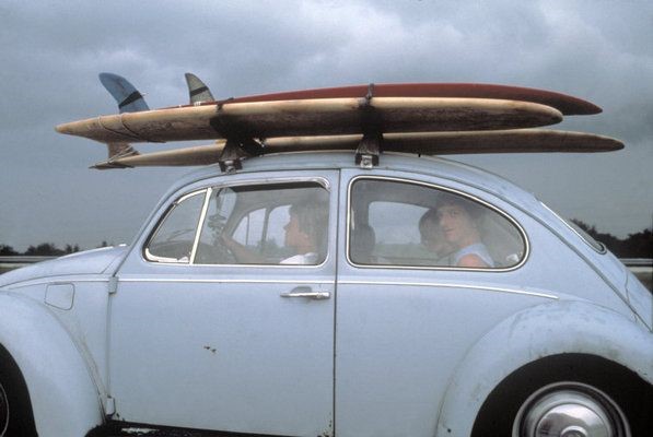 VW Bug with surfboard on top